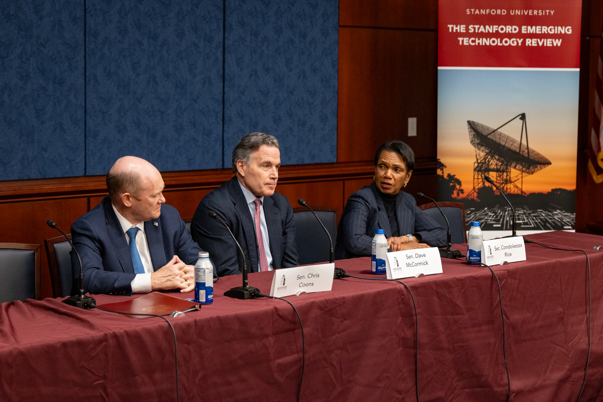 Director Rice engages Senators Coons and McCormick in conversation during their panel session.