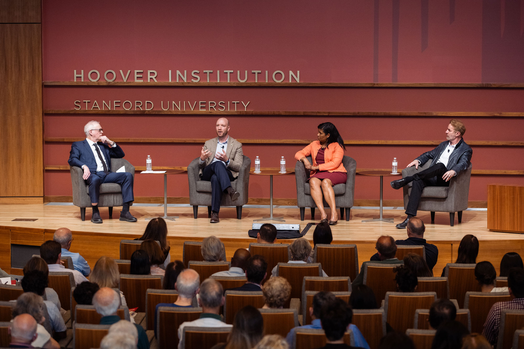 Hoover Research Director Steven J. Davis (left), Anthropic Head of Economics Peter McCrory, LinkedIn Chief Economist Karin Kimbrough and Erik Brynjolfsson of the Stanford Digital Economy Lab speak in Hauck Auditorium. (Patrick Beaudouin)