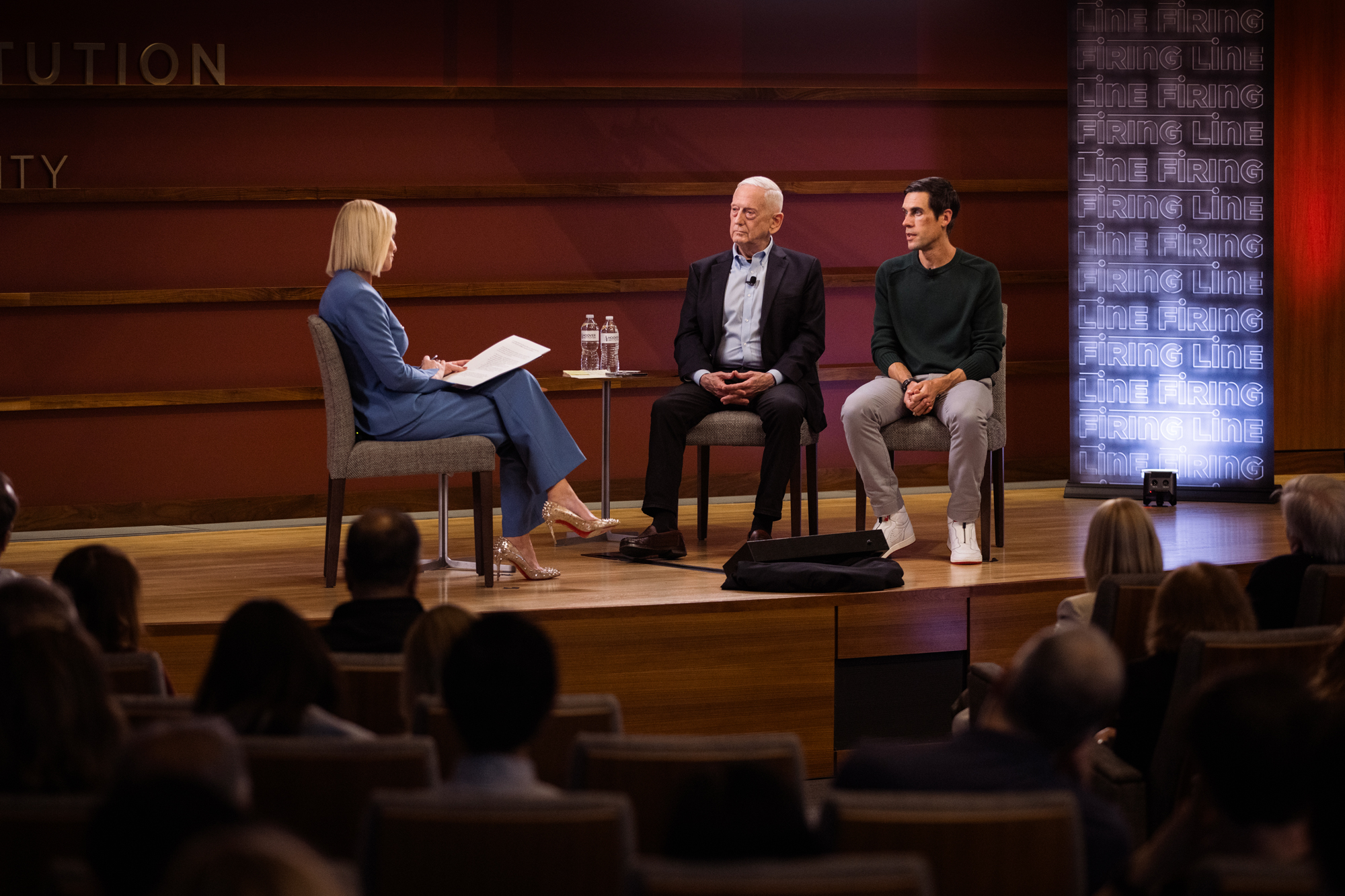 Distinguished Fellow Jim Mattis and author Ryan Holiday are seen in Hauck Auditorium during a live taping of PBS’s The Firing Line on March 18, 2026. (Patrick Beaudouin)
