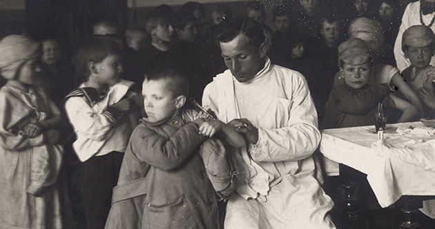 black and white photograph showing a young boy receiving the tetra-vaccine in Petrograd circa 1922