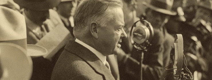 Detail of sepia tone photograph of Herbert Hoover speaking into microphones