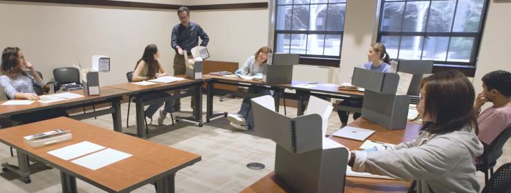 Photograph of Bert Patenaude working with students