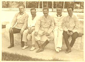 Stalin sitting with a group of men