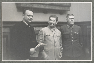 Stalin standing with two men