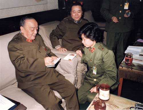 Photograph of Jiang Lin (right) and Yang Shangkun (left) who is sitting on a chair