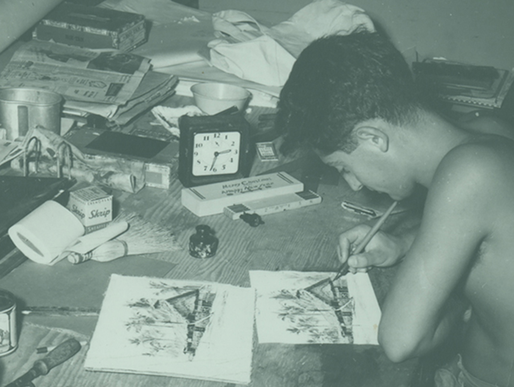 Seabee Ballantoni at his desk drawing durring World War II