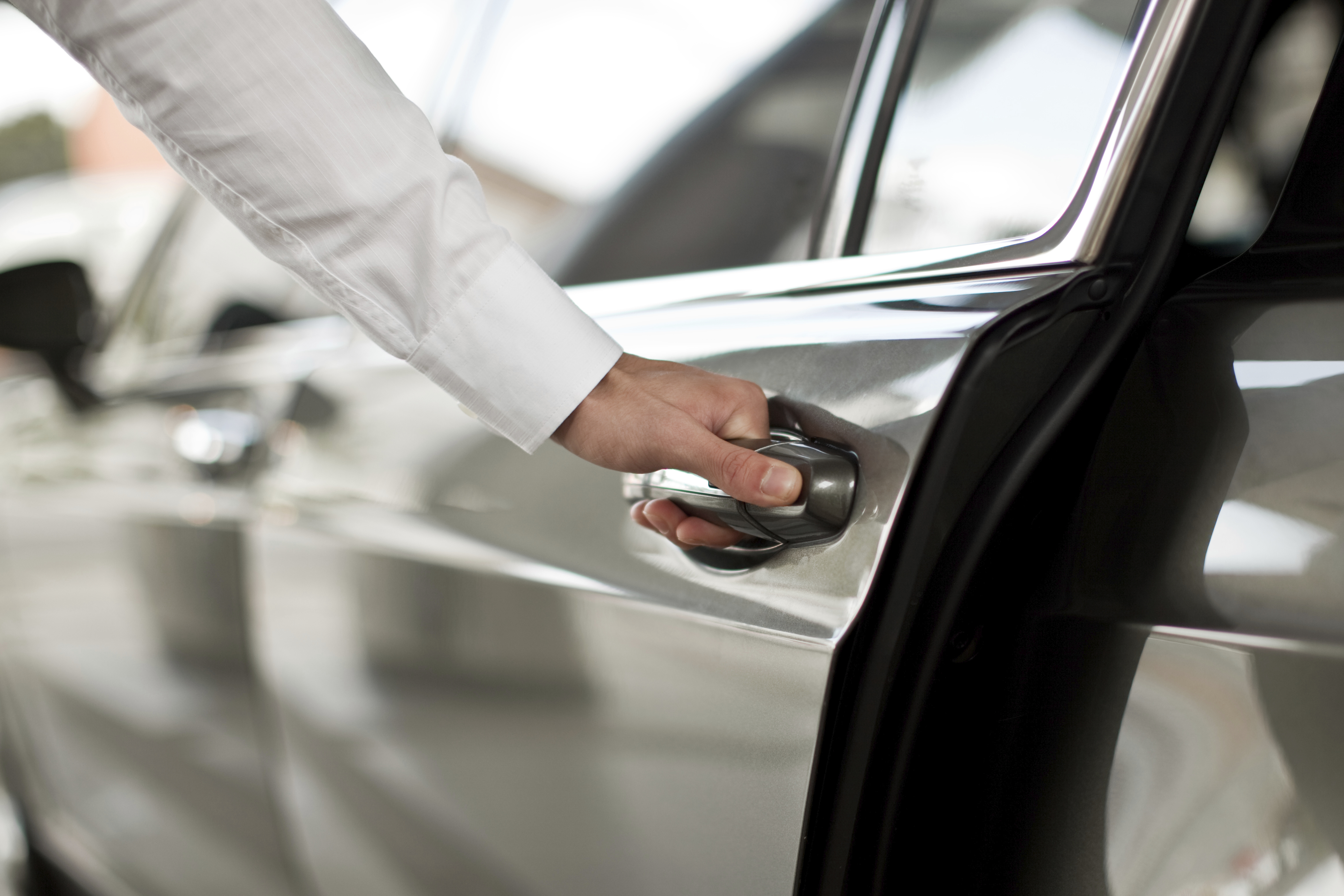 Man opening a car door