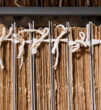 Cotton tied newspapers