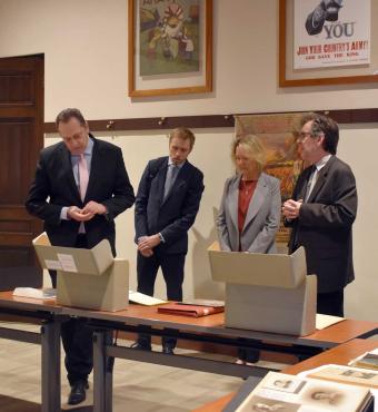 Latvian Ambassador delegation viewing library and archival material