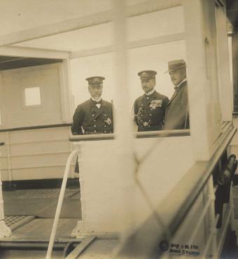 3 men standing on the deck of the Tanba Maru