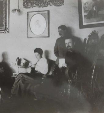 Trubetskoi with group in a sitting room