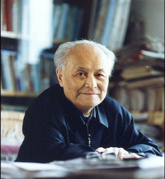 Color photograph of Li Rui at desk