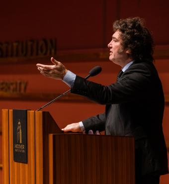 Argentine President Javier Milei gestures at the podium as he speaks in Hauck Auditorium on May 29, 2024.