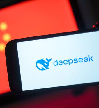 DeepSeek logo in front of a Chinese flag