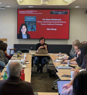 Dian Zhong speaking at an event