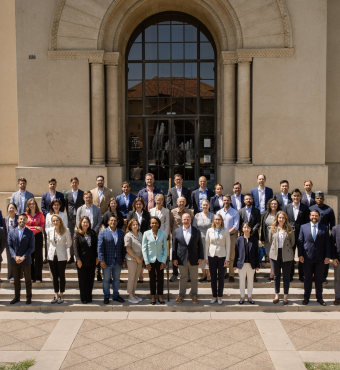 The 2025 cohort of Hoover Institution International Seminar participants are seen outside Hoover Tower with Condoleezza Rice and H.R. McMaster (center) on June 23, 2025. (Patrick Beaudouin)
