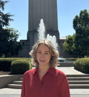 Jenna Mollerus in front of the Hoover Tower