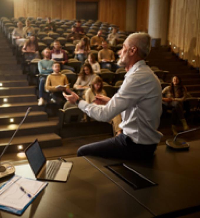 college professor with students istock image