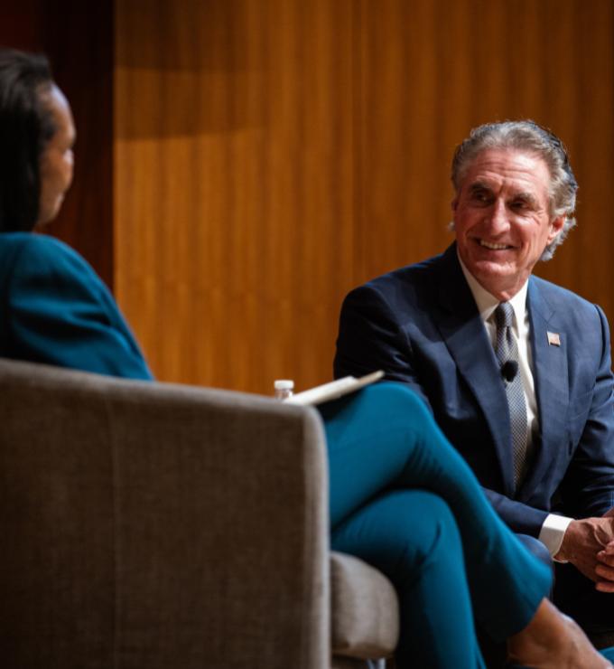 US Secretary of the Interior Doug Burgum is seen in Hauck Auditorium with Hoover Institution Director Condoleezza Rice on October 10, 2025. (Patrick Beaudouin)