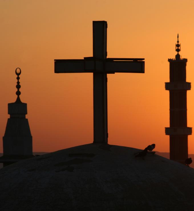Egyptian sunrise with cross and crescents stock photo