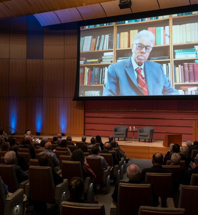 Thomas Sowell speaks on screen inside Hauck Auditorium at a celebration of his career on October 20, 2025. (Patrick Beaudouin)