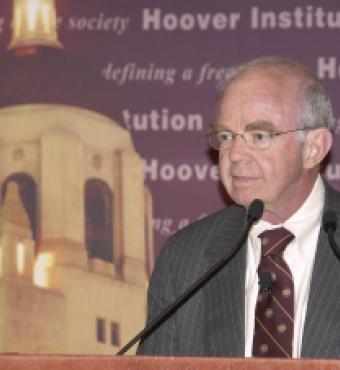 Martin Anderson speaks at the Summer Board of Overseers meeting in 2009.