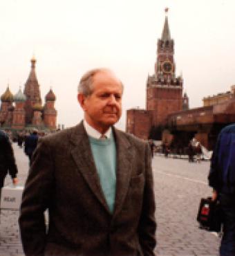 Robert Conquest and a television crew prepare for a scene in the documentary Red Empire