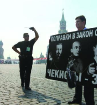 A security officer confronts a Red Square protester