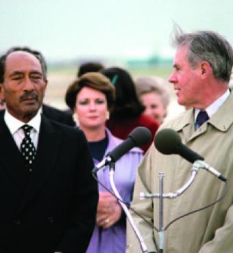 Egyptian President Anwar Sadat, left, arrives at Andrews Air Force Base in 1980