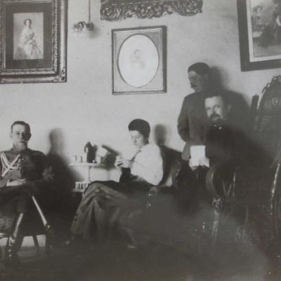 Trubetskoi with group in a sitting room