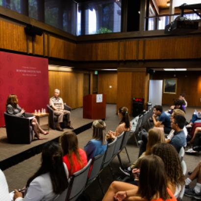 Amy Zegart (left) and General Paul Nakasone in a fireside chat at the Hoover Institution with an audience of Stanford University students.