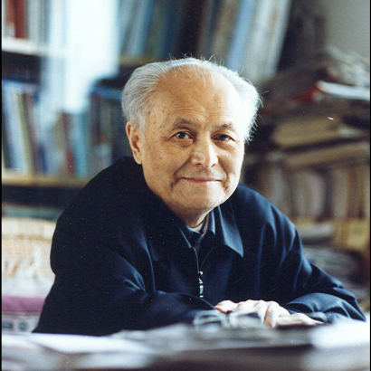 Color photograph of Li Rui at desk