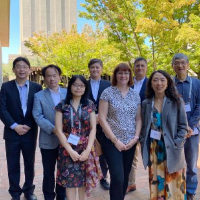 Modern China and Taiwan Workshop 2023 speakers stand in front of Hoover Tower and HHMB