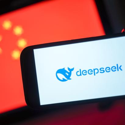 DeepSeek logo in front of a Chinese flag