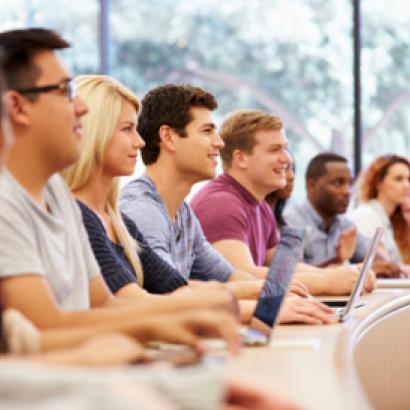 Class Of University Students Using Laptops In Lecture stock photo