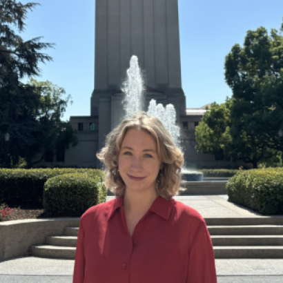 Jenna Mollerus in front of the Hoover Tower
