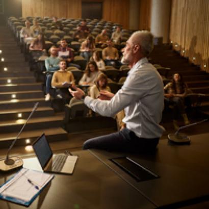 college professor with students istock image
