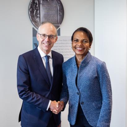 Luxembourg Prime Minister Luc Frieden and Hoover Institution Director Condoleezza Rice shake hands in Hoover’s George P. Shultz Building on November 11, 2025. (Patrick Beaudouin) 