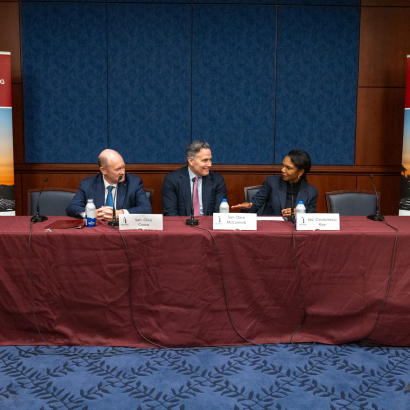 Director Rice, Senators Coons, and McCormick in conversation during their panel session.