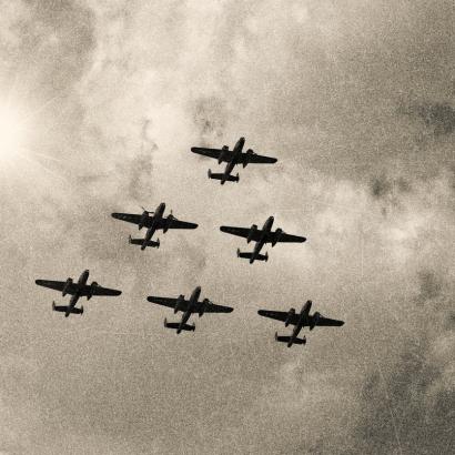 WW2 Mitchell B-25 Medium Bombers flying in V-Formation stock photo