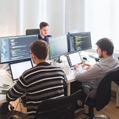 Software developing team working in the office stock photo
