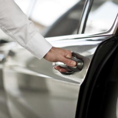 Man opening a car door