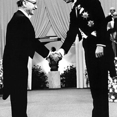 Milton Friedman receives the 1976 Bank of Sweden Prize in Economic Sciences in Memory of Alfred Nobel from King Carl XVI Gustaf of Sweden.