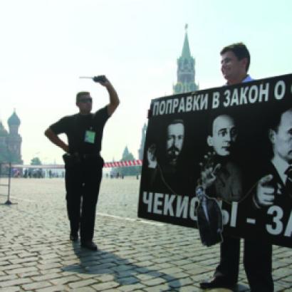 A security officer confronts a Red Square protester