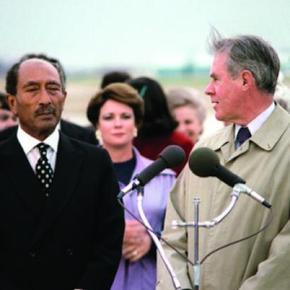 Egyptian President Anwar Sadat, left, arrives at Andrews Air Force Base in 1980