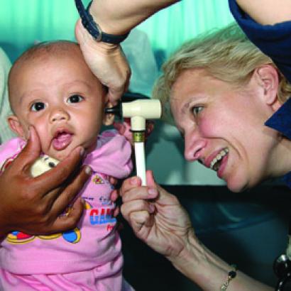 Ronda Bouwens examines a baby