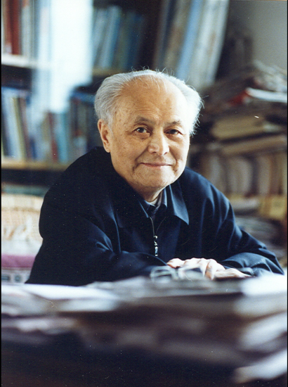 Color photograph of Li Rui at desk