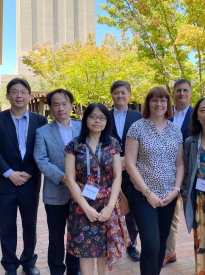 Modern China and Taiwan Workshop 2023 speakers stand in front of Hoover Tower and HHMB