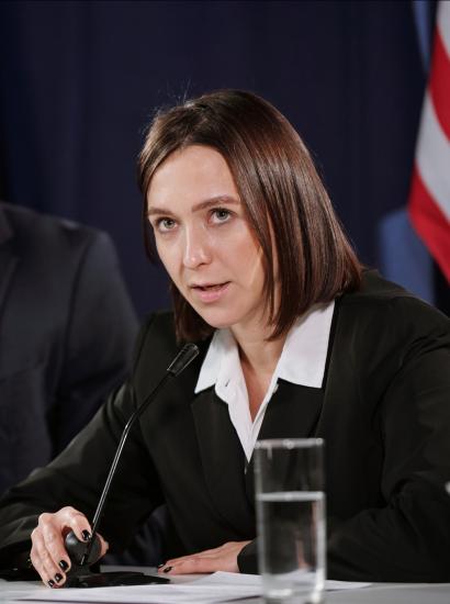 Young confident female politician in formalwear speaking in microphone stock photo (iStock)