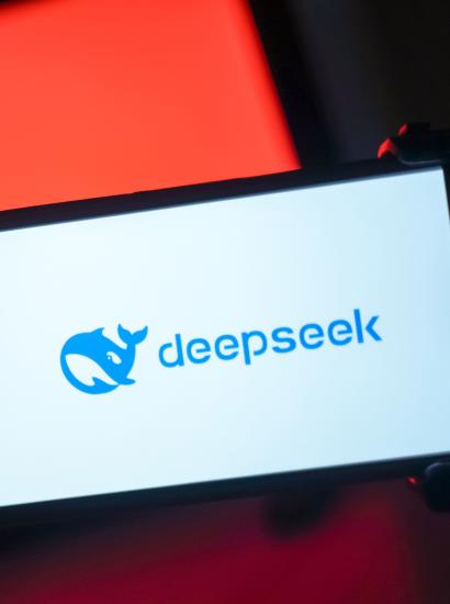 DeepSeek logo in front of a Chinese flag
